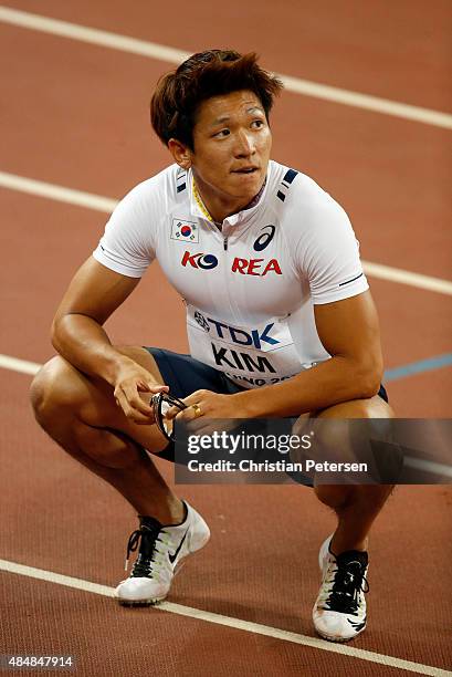 Kukyoung Kim of Korea looks on after he competes in the Men's 100 metres heats during day one of the 15th IAAF World Athletics Championships Beijing...