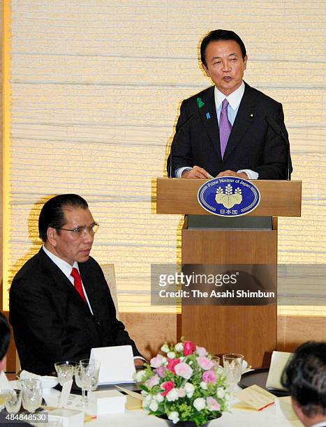 Japanese Prime Minister Taro Aso addresses during a welcome dinner inviting Vietnam Communist Party General Secretary Nong Duc Manh at Aso's official...