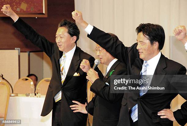 Newly Elected opposition Democratic Party of Japan President Yukio Hatoyama and candidate Katsuya Okada raise their fists after the election on May...