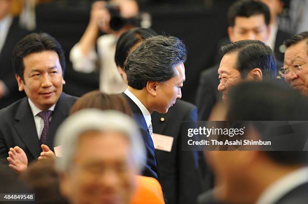 Newly elected opposition Democratic Party of Japan President Yukio Hatoyama and outgoing president Ichiro Ozawa talk after the election on May 16,...