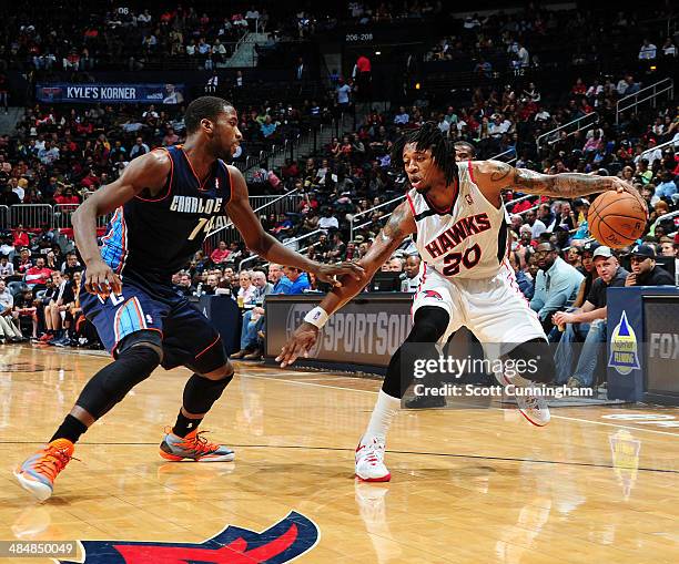 Cartier Martin of the Atlanta Hawks handles the ball against the Charlotte Bobcats on April 14, 2014 at Philips Arena in Atlanta, Georgia. NOTE TO...