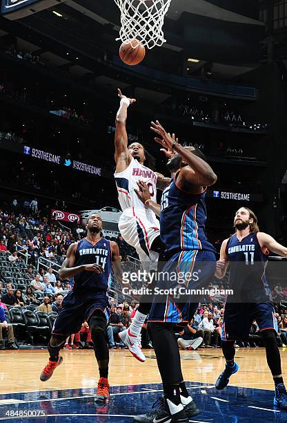 Cartier Martin of the Atlanta Hawks shoots against the Charlotte Bobcats on April 14, 2014 at Philips Arena in Atlanta, Georgia. NOTE TO USER: User...