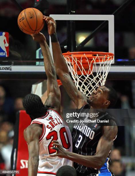 Dewayne Dadmon of the Orlando Magic blocks a shot by Tony Snell of the Chicago Bulls at the United Center on April 14, 2014 in Chicago, Illinois....