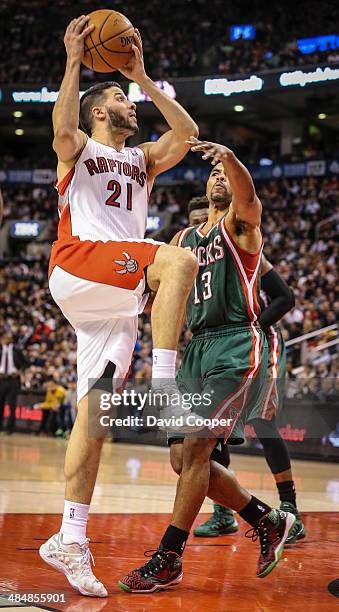 Toronto Raptors guard Greivis Vasquez shooting to make it 101 for the Raptors late in the gameguarded by Milwaukee Bucks guard Ramon Sessions during...