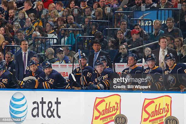 Assistant coach Teppo Numminen, head coach Ted Nolan and assistant coach Joe Sacco of the Buffalo Sabres watch the action against the Tampa Bay...