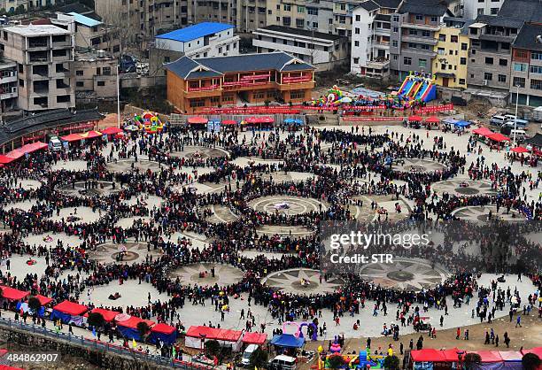 China-tourism-culture-social,FEATURE by Carol Huang This picture taken on February 19, 2014 shows people celebrating the Reed Pipe Festival of the...