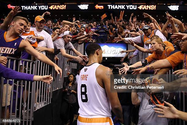 Fans reach for Channing Frye of the Phoenix Suns as he walks off the court following the NBA game against the Memphis Grizzlies at US Airways Center...