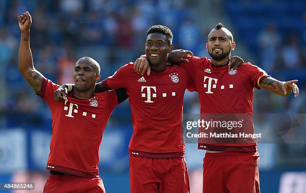 Douglas Costa of Muenchen, David Alaba of Muenchen and Arturo Vidal of Muenchen celebrate after the Bundesliga match between 1899 Hoffenheim and FC...