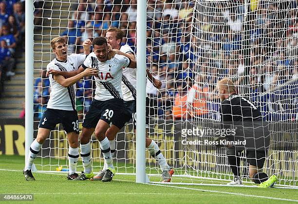 Dele Alli of Tottenham Hotspur celebrates scoring his team's first goal with his team mates Tom Carroll and Harry Kane during the Barclays Premier...