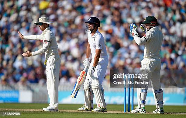 England batsman Alastair Cook and keeper Peter Nevil look on as captain Michael Clarke sets his field during day three of the 5th Investec Ashes Test...