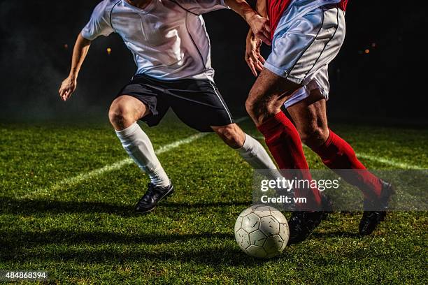 soccer players in action - defense player bildbanksfoton och bilder