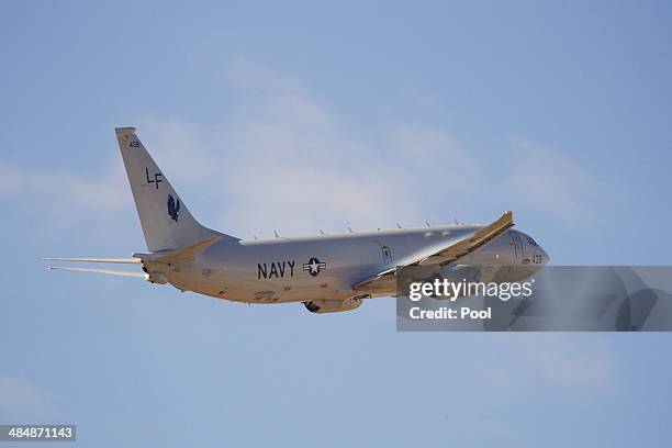 United States Navy Boeing P-8 Poseidon takes off from Perth International airport as part of a search to locate missing Malaysia Airways Flight MH370...