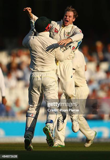 Steve Smith of Australia celebrates after taking the wicket of Alastair Cook of England during day three of the 5th Investec Ashes Test match between...