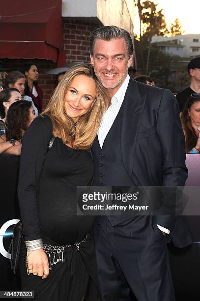 Actor Ray Stevenson and Elisabetta Caraccia arrive at the Los Angeles premiere of 'Divergent' at Regency Bruin Theatre on March 18, 2014 in Los...