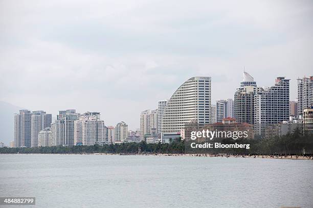 Hotels and residential buildings stand in the Sanya Bay district of Sanya, Hainan, China, on Sunday, April 6, 2014. Chinas broadest measure of new...