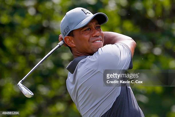 Tiger Woods tees off on the eighth hole during the third round of the Wyndham Championship at Sedgefield Country Club on August 22, 2015 in...