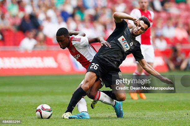 Riechedly Bazoer of Ajax battles for the ball with Martin Pospisil of FK Baumit Jablonec during the UEFA Europa League play off round 1st leg match...