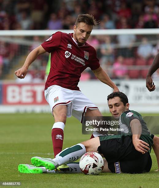 Lawson D'Ath of Northampton Town contests the ball with Carl McHugh of Plymouth Argyle during the Sky Bet League Two match between Northampton Town...