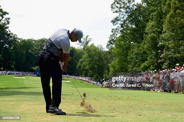 Tiger Woods tees off on the third hole during the third round of the Wyndham Championship at Sedgefield Country Club on August 22, 2015 in...