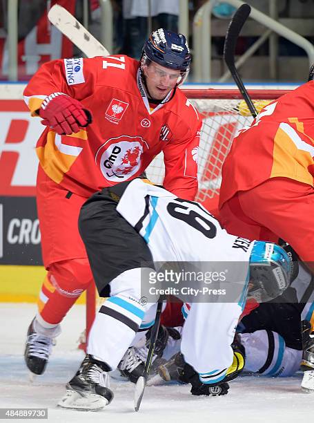 Andrew Jacob Kozek of the Black Wings Linz and Travis Turnbull of the Duesseldorfer EG fight for the puck during the game between Duesseldorfer EG...