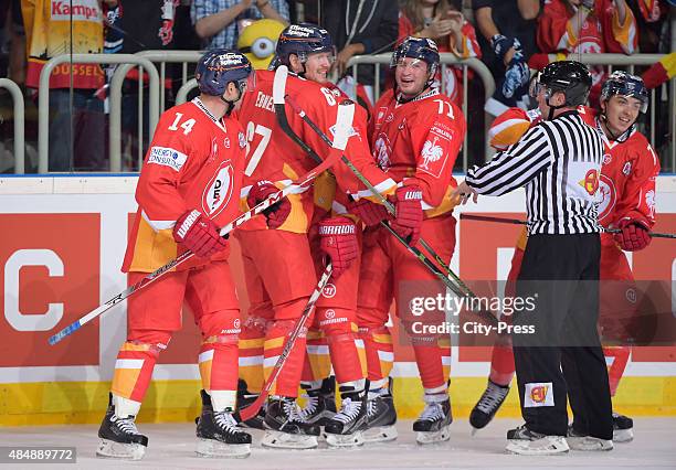 Norm Milley, Bernhard Ebner and Travis Turnbull of the Duesseldorfer EG celebrate after scoring the 4:2 during the game between Duesseldorfer EG and...