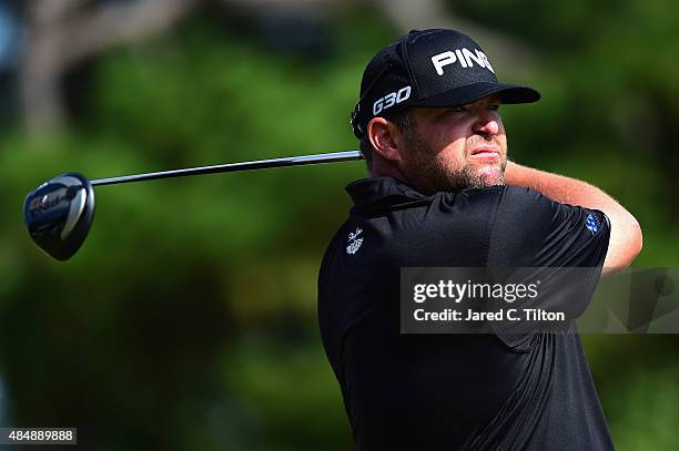 Jason Gore tees off on the 18th hole during the third round of the Wyndham Championship at Sedgefield Country Club on August 22, 2015 in Greensboro,...