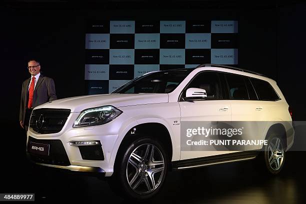 Mercedes-Benz India Managing Director Eberhard Kern poses with the new GL 63 AMG during its launch in Mumbai on April 15, 2014. Sales of India's...