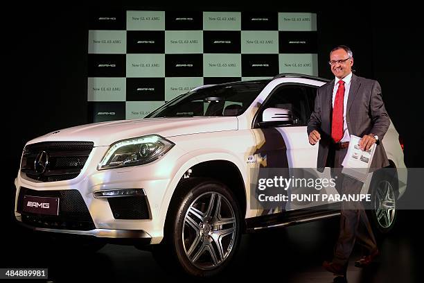 Mercedes-Benz India Managing Director Eberhard Kern poses with the new GL 63 AMG during its launch in Mumbai on April 15, 2014. Sales of India's...