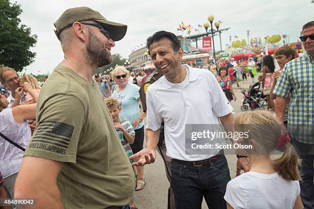 Republican presidential candidate Louisiana Governor Bobby Jindal greets visitors at the Iowa State Fair on August 22, 2015 in Des Moines, Iowa....