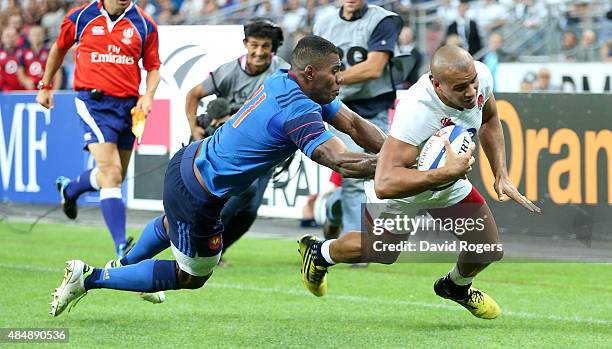 Jonathan Joseph of England dives in the corner to score a late try during the International match between France and England at Stade de France on...