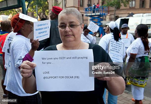 Susan Malan from the "Support for Oscar" Facebook group wait for Oscar Pistorius to arrive at the Pretoria High Court on April 15 in Pretoria, South...