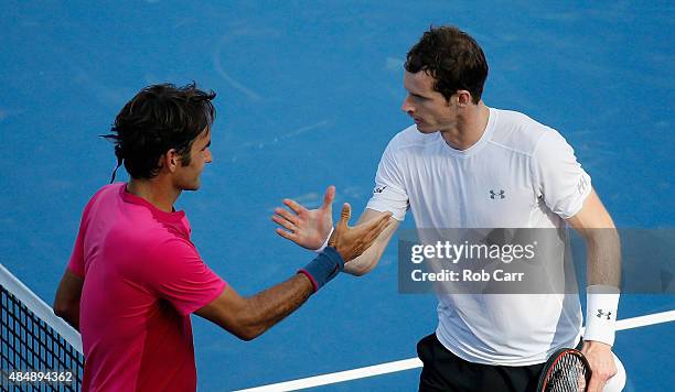 Roger Federer of Switzerland shakes hands with Andy Murray of Great Britain after winning during the semifinals of the Western & Southern Open at the...