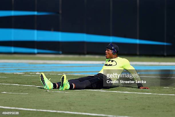 Cam Newton of the Carolina Panthers warms up ahead of their game against the Miami Dolphins at Bank of America Stadium on August 22, 2015 in...