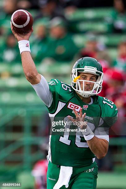 Brett Smith of the Saskatchewan Roughriders throws a pass in warmup before the game between the Calgary Stampeders and Saskatchewan Roughriders in...