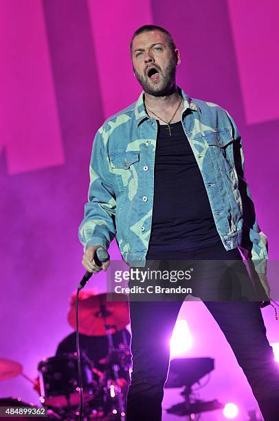 Tom Meighan of Kasabian headlines on the Virgin Media stage during Day 1 of the V Festival at Hylands Park on August 22, 2015 in Chelmsford, England.