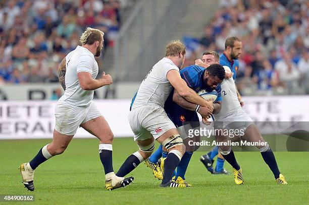 Mathieu Bastareaud of France is tacked by George Ford of England during the International friendly match between France and England at Stade de...