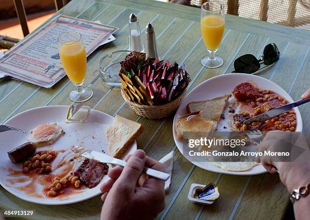 Couple eat an English berakfast in an cafe on Puerto del Carmen promenade on April 13, 2014 in Lanzarote, Spain. Lanzarote, where British Prime...