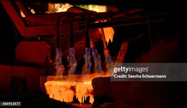 Molten copper is cast into copper anodes in the foundry of Aurubis AG, an employee is controlling the melting and casting process on February 7, 2014...