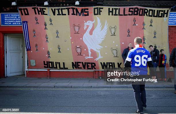 An Everton fan arrives in Anfield for a memorial service marking the 25th anniversary of the Hillsborough Disaster at Anfield stadium on April 15,...