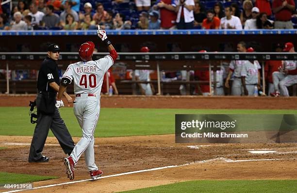 Aaron Altherr of the Philadelphia Phillies rounds the bases after hitting a solo home run in the ninth inning off of A.J. Ramos of the Miami Marlins...