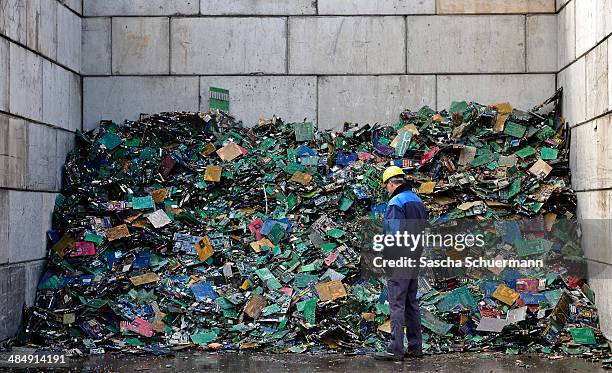 Electronic components including circuit boards sit in a pile before being melted down at the Aurubis recycling smelter on April 14, 2014 in Luenen,...