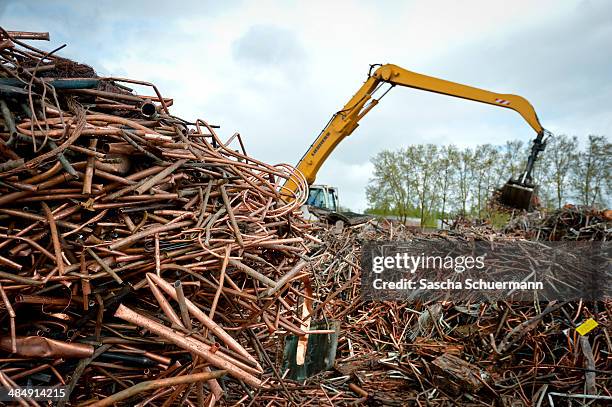 Scrap copper sits in a heap ahead before being melted down at the Aurubis recycling smelter on April 14, 2014 in Luenen, Germany. Aurubis is...