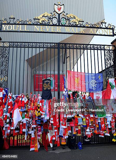 In this handout image provided by Liverpool FC, football scarves and tributes are placed at the Hillsborough memorial during the memorial service...