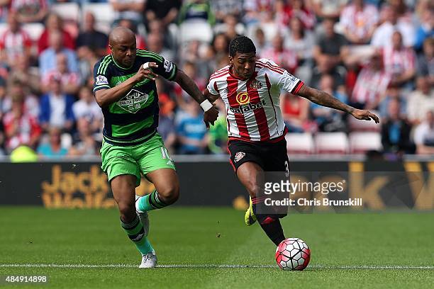 Andre Ayew of Swansea City and Patrick van Aanholt of Sunderland compete for the ball during the Barclays Premier League match between Sunderland and...