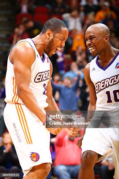 Austin Freeman of the Iowa Energy and Curtis Stinson of the Iowa Energy celebrate after making a shot and drawing the foul against the Rio Grande...