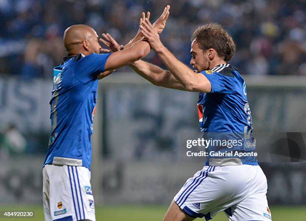 Federico Insua of Millonarios celebrates with Lewis Ochoa after scoring the first goal of his team during a match between La Equidad and Millonarios...