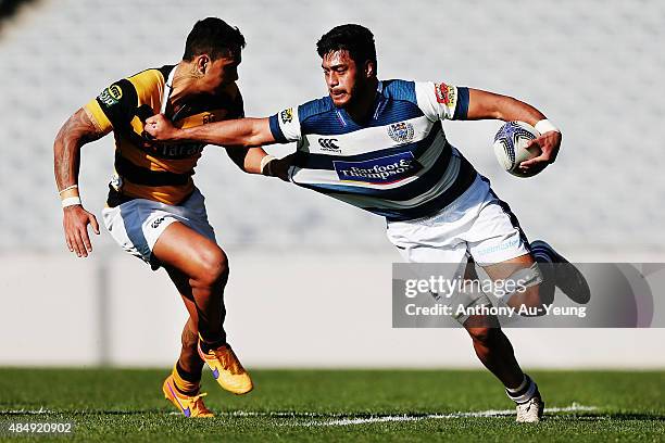 Akira Ioane of Auckland fends off Sean Wainui of Taranaki during the round two ITM Cup match between Auckland and Taranaki at Eden Park on August 23,...