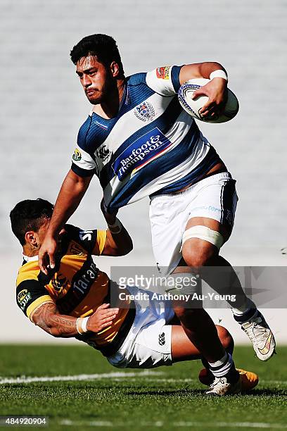Akira Ioane of Auckland fends off Sean Wainui of Taranaki during the round two ITM Cup match between Auckland and Taranaki at Eden Park on August 23,...
