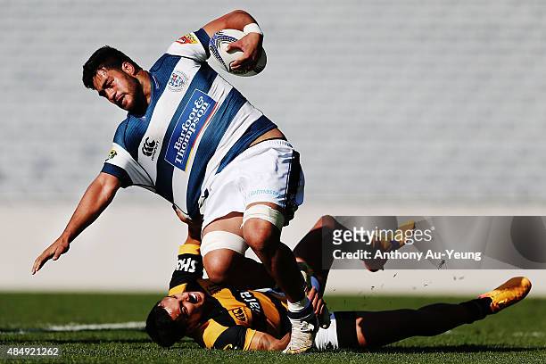 Akira Ioane of Auckland fends off Sean Wainui of Taranaki during the round two ITM Cup match between Auckland and Taranaki at Eden Park on August 23,...