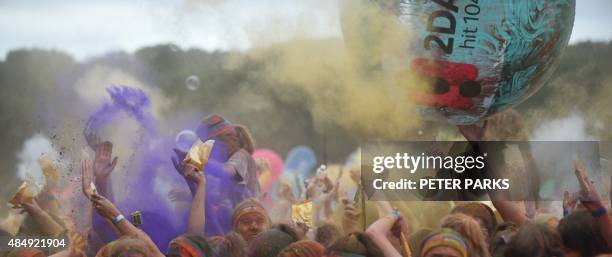 People participate in the annual Color Run after party in Centennial Park in Sydney on August 23, 2015. The Color Run is a 5km fun run started in the...